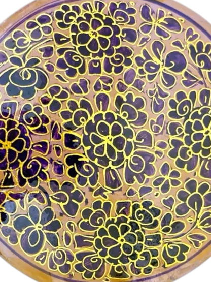 Noori Couture handpainted papier-mâché coaster with floral design in purple and gold.