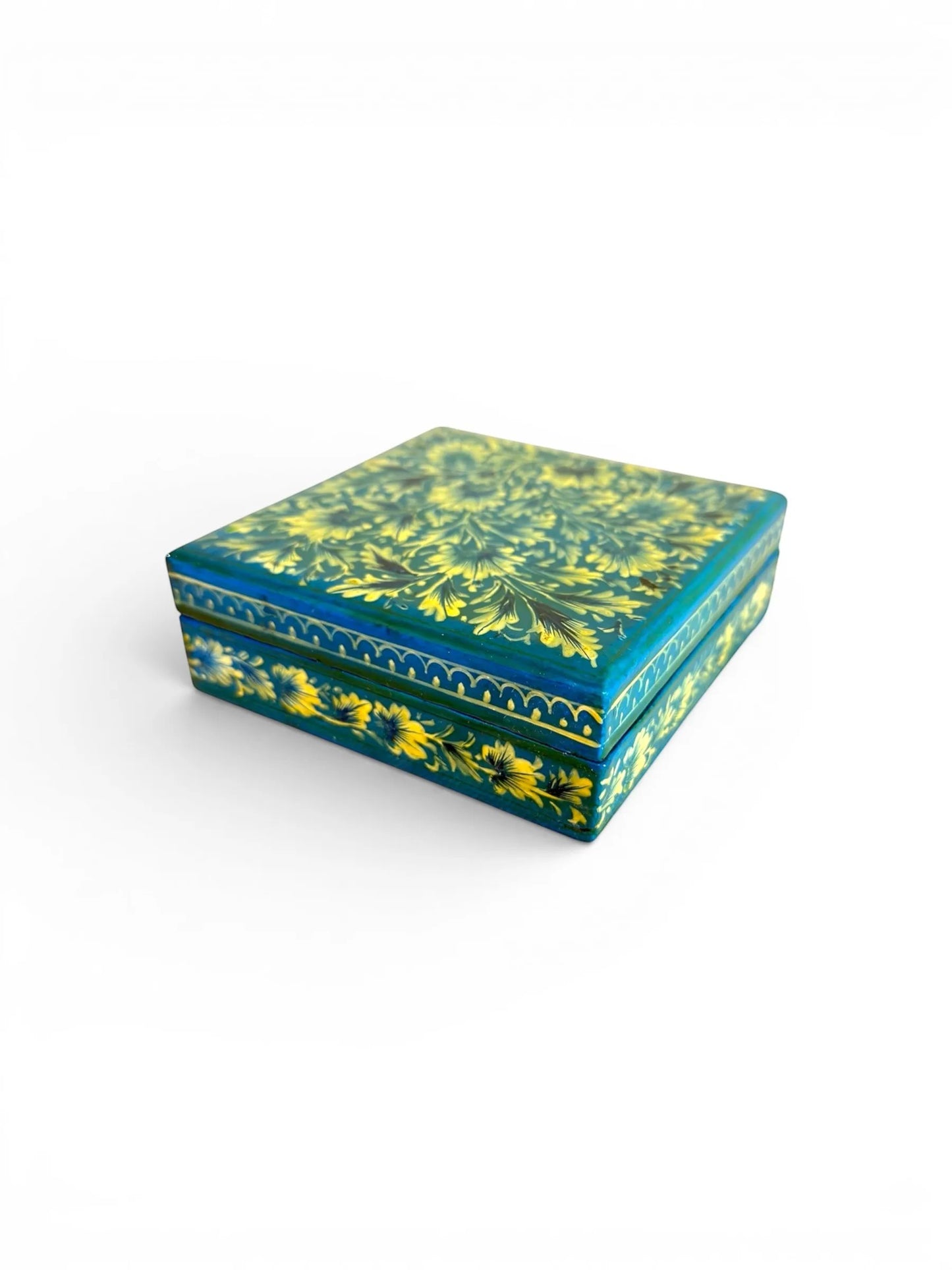 Noori Couture hand-painted papier-mâché coaster set with floral detailing in yellow and teal, includes storage box.