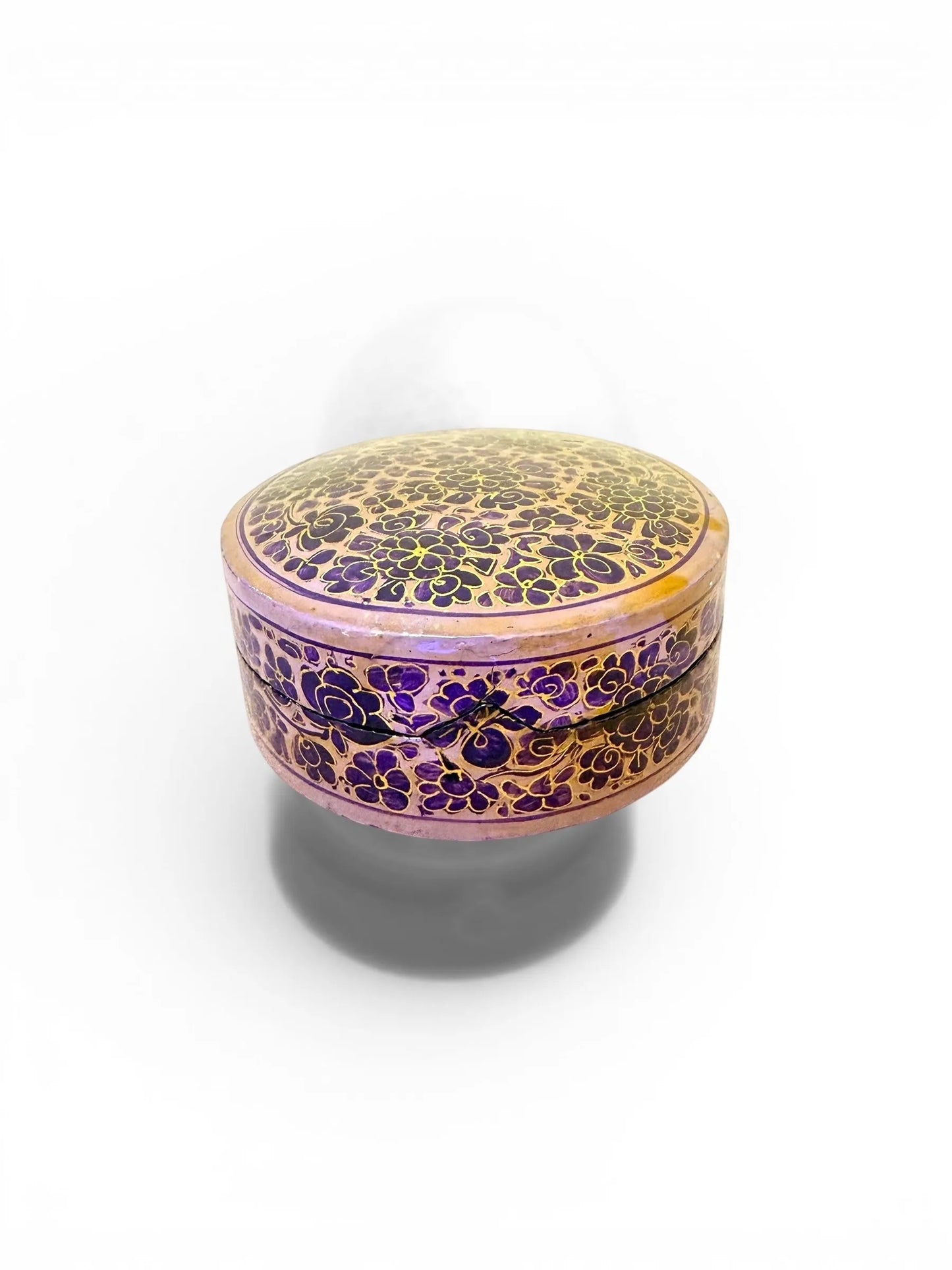 Noori Couture handpainted papier-mâché round coaster set with intricate floral patterns in purple and gold.