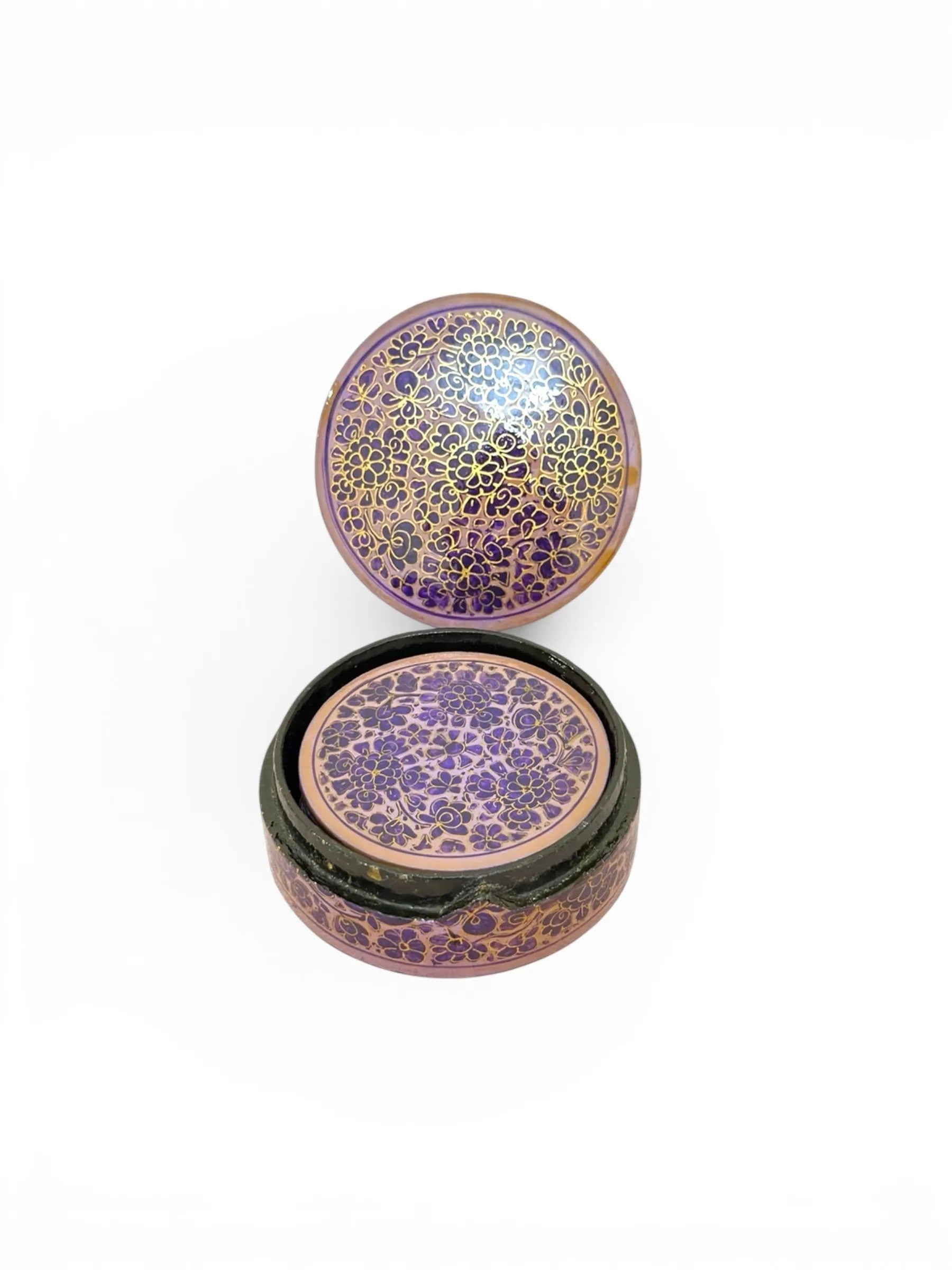 Noori Couture handpainted papier-mâché round coasters with intricate purple and gold floral design, stored in a matching holder.