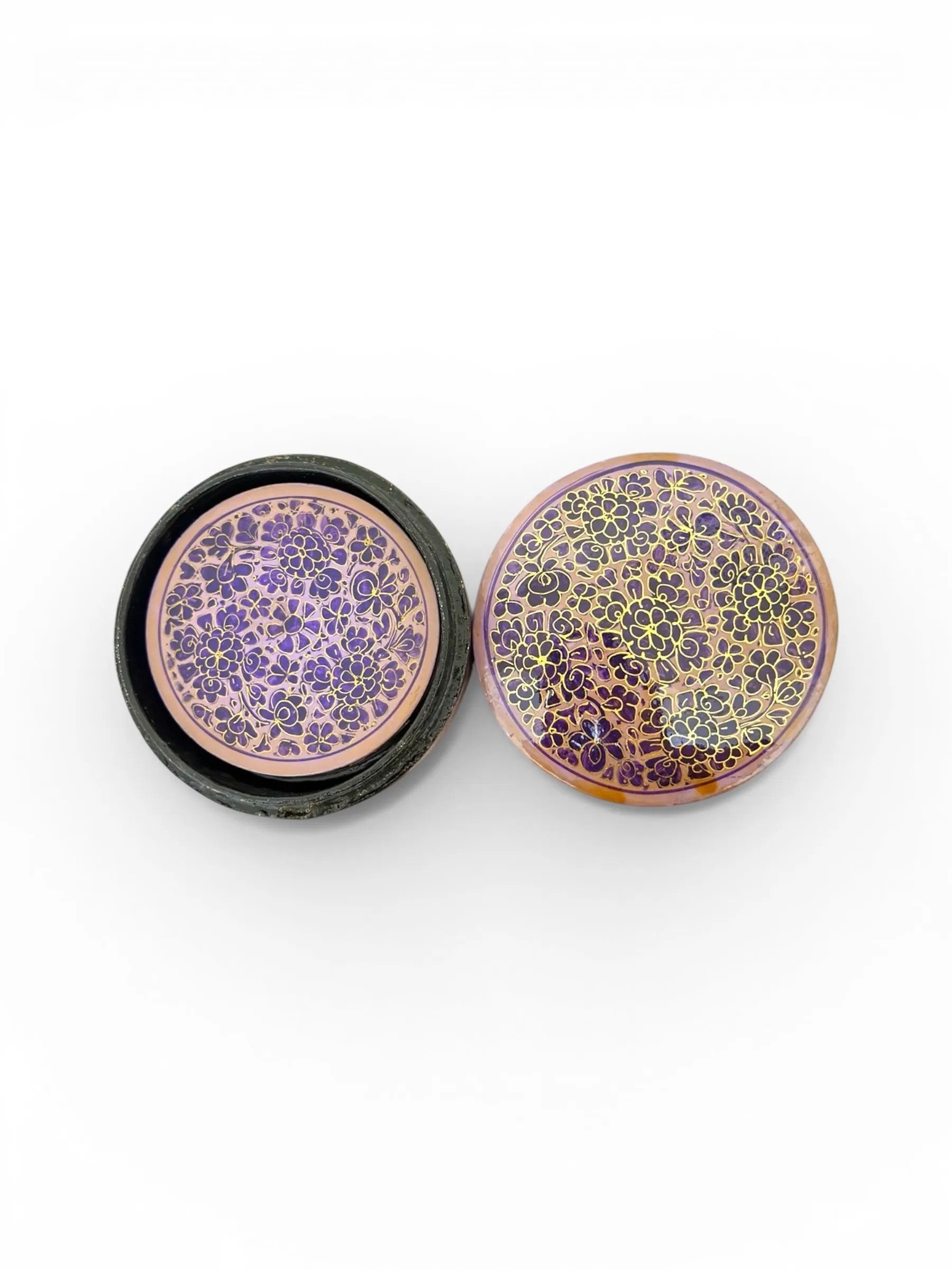 Noori Couture handpainted papier-mâché round coasters with intricate floral patterns in purple and gold.