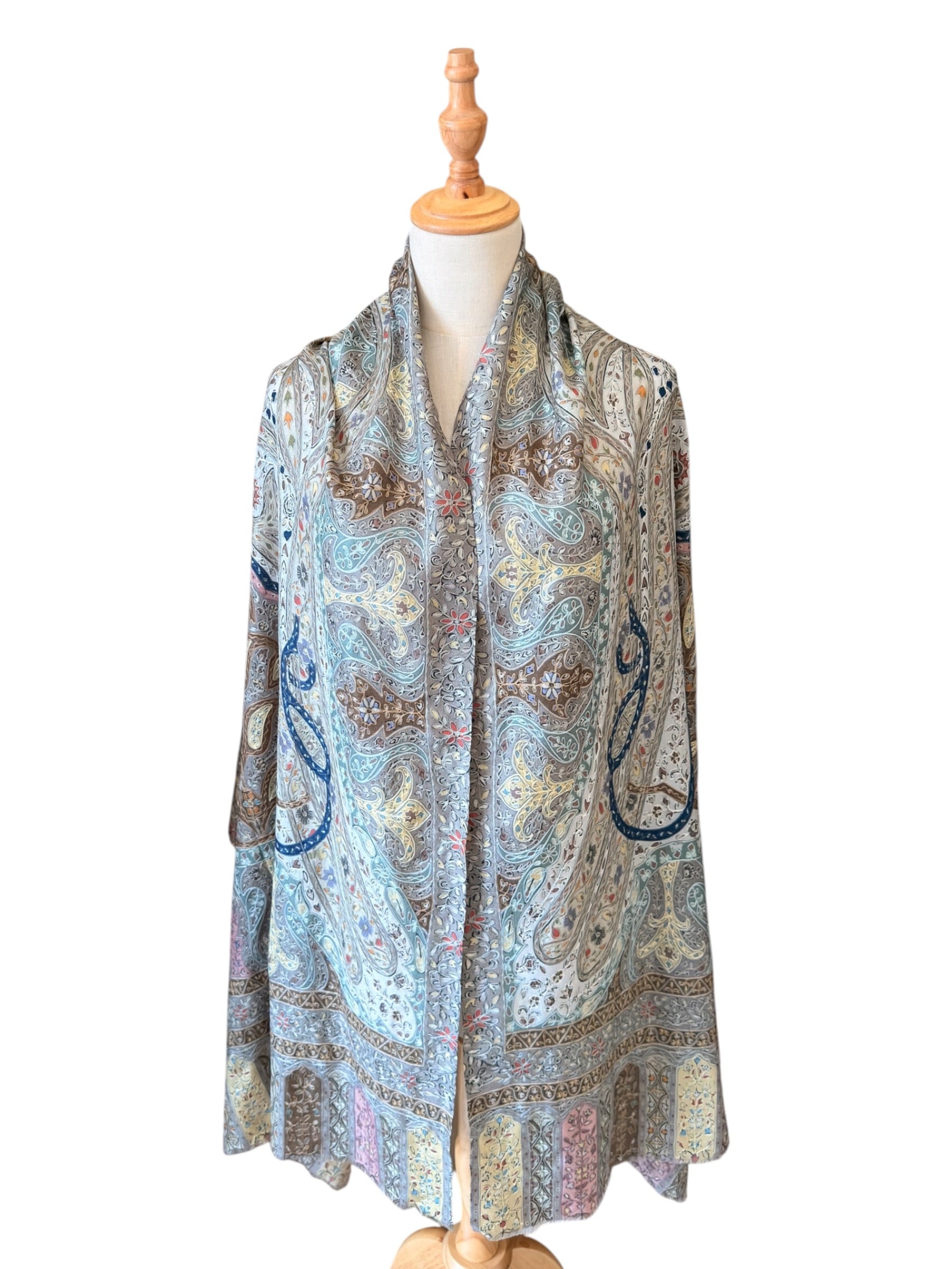 Noori Couture handwoven aqua merino wool shawl featuring intricate hand-painted Kalamkari motifs and silk embroidery.
