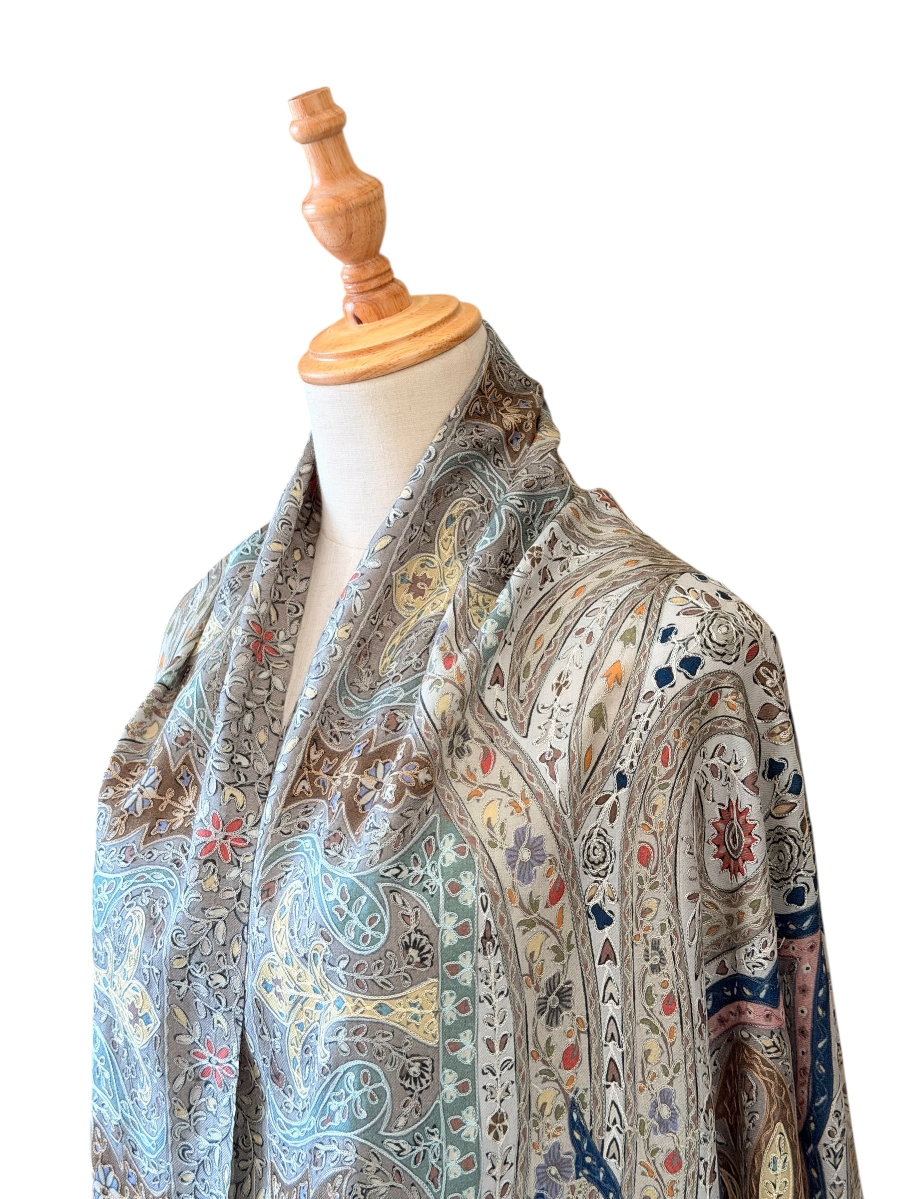 Noori Couture handwoven aqua Merino wool and silk shawl featuring intricate hand-painted Kalamkari floral motifs.