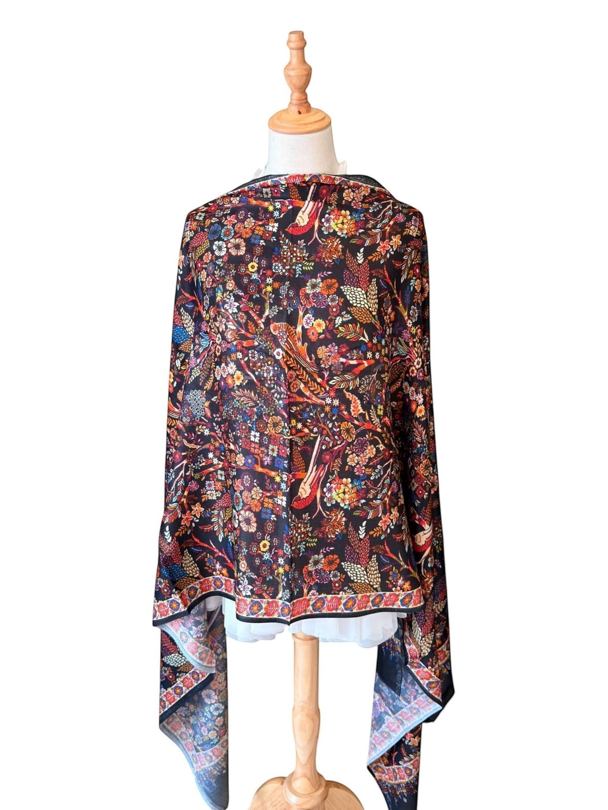 Noori Couture multicoloured digital Kani print shawl in a luxurious modal, bamboo, and silk blend on a mannequin.