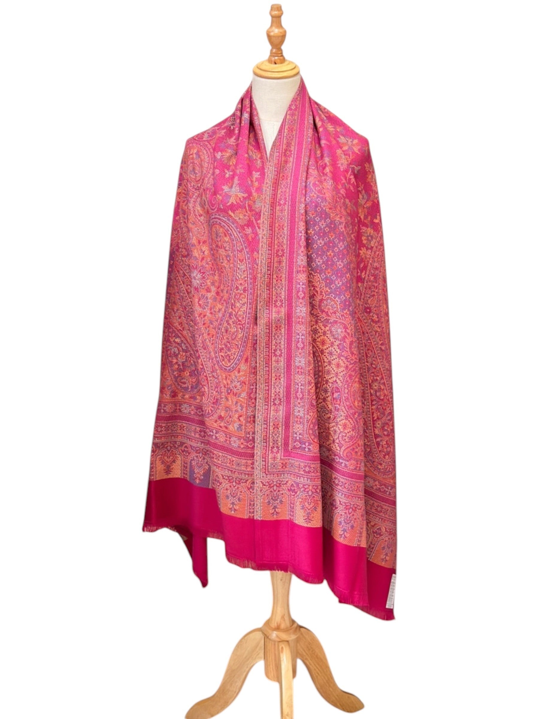 Noori Couture magenta pashmina shawl featuring an intricate traditional paisley pattern and delicate fringe edges.