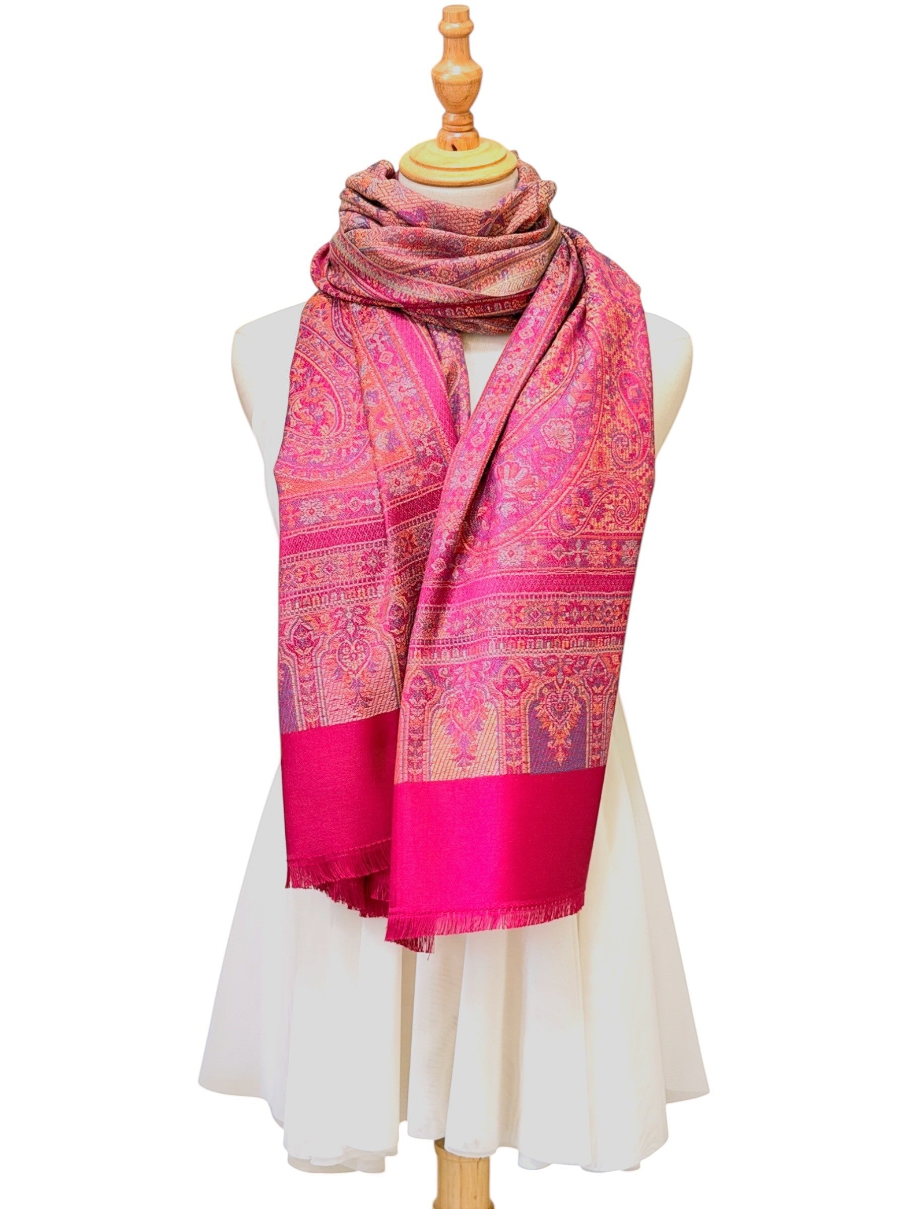 Noori Couture magenta pashmina shawl featuring an intricate traditional paisley pattern and delicate fringe edges.