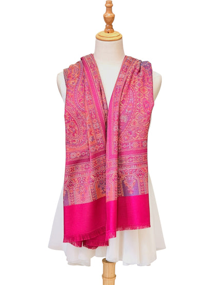 Noori Couture magenta pashmina shawl with intricate traditional paisley patterns and delicate fringe on a mannequin.
