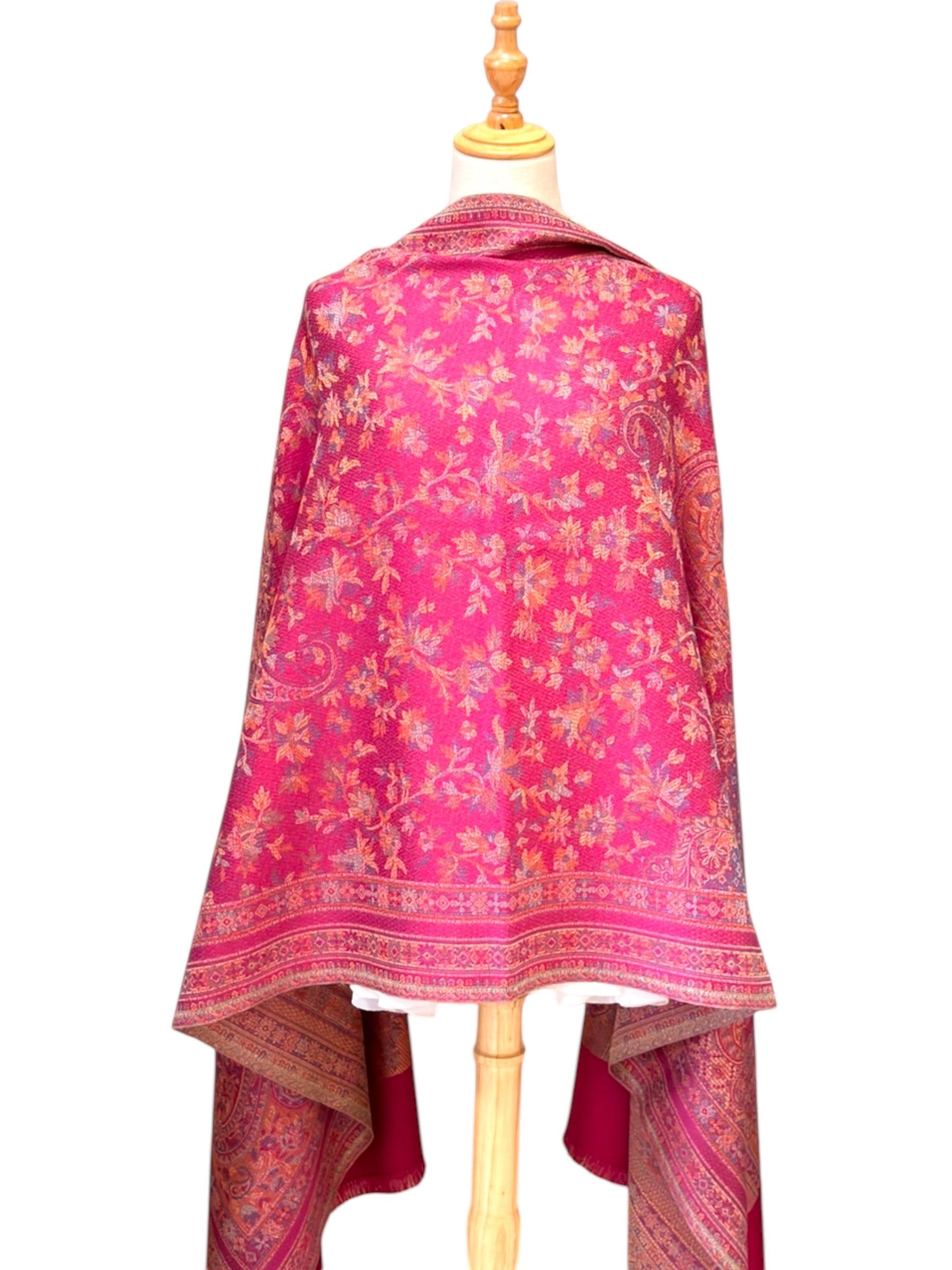 Noori Couture magenta pashmina shawl featuring an intricate traditional paisley pattern and delicate fringe edges.
