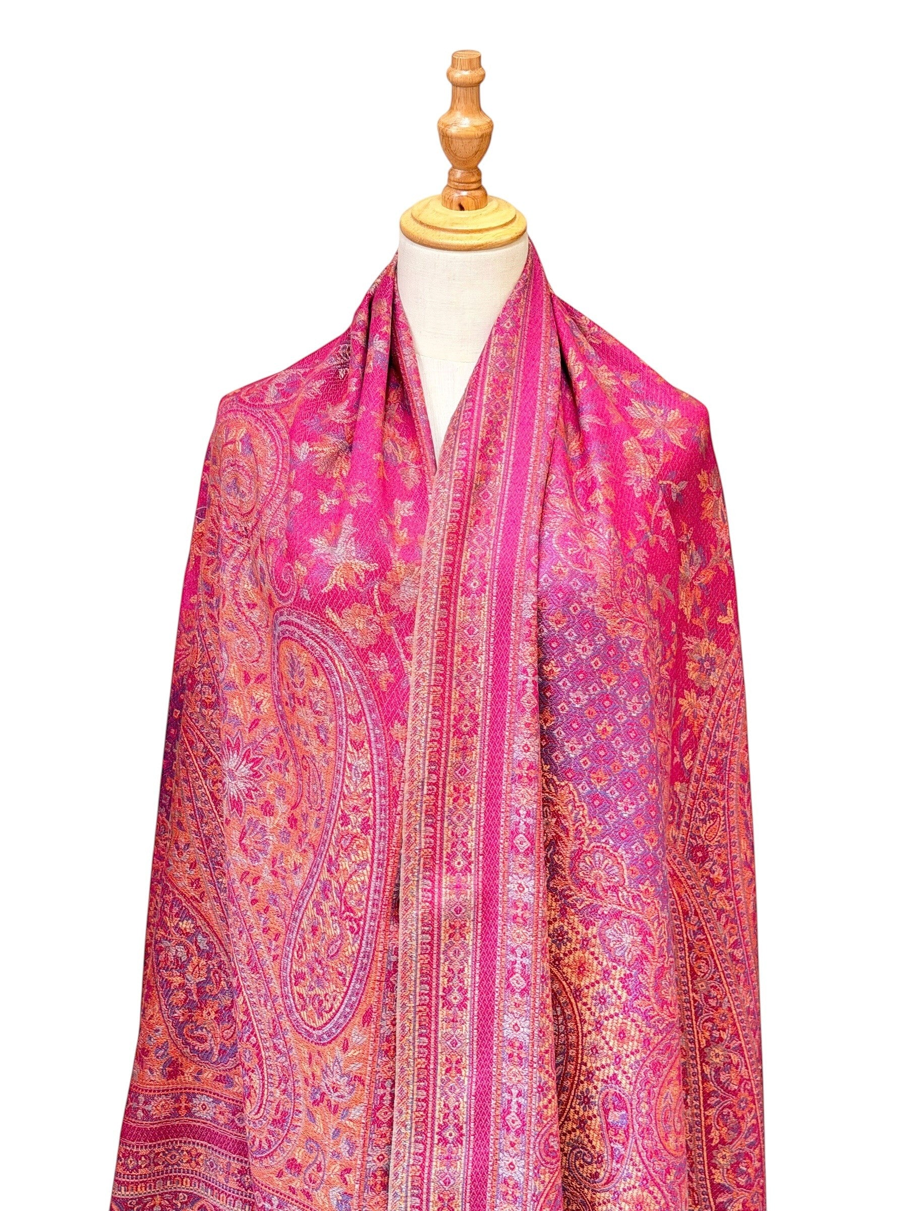 Noori Couture magenta pashmina shawl featuring an intricate traditional paisley pattern and delicate fringe edges.