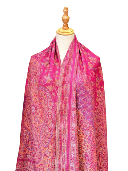 Noori Couture magenta pashmina shawl featuring an intricate traditional paisley pattern and delicate fringe edges.