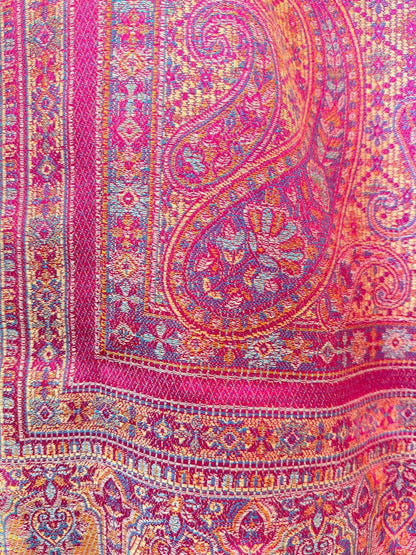 Noori Couture magenta pashmina shawl featuring an intricate multi-colored traditional paisley pattern and woven border