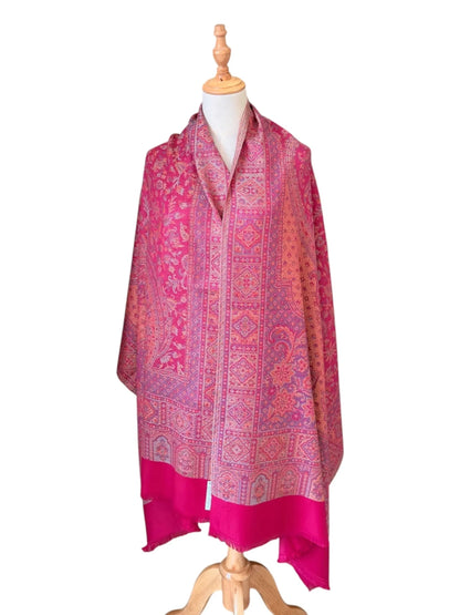 Noori Couture magenta pink shawl wrap with intricate traditional woven patterns and delicate fringe edge detail.