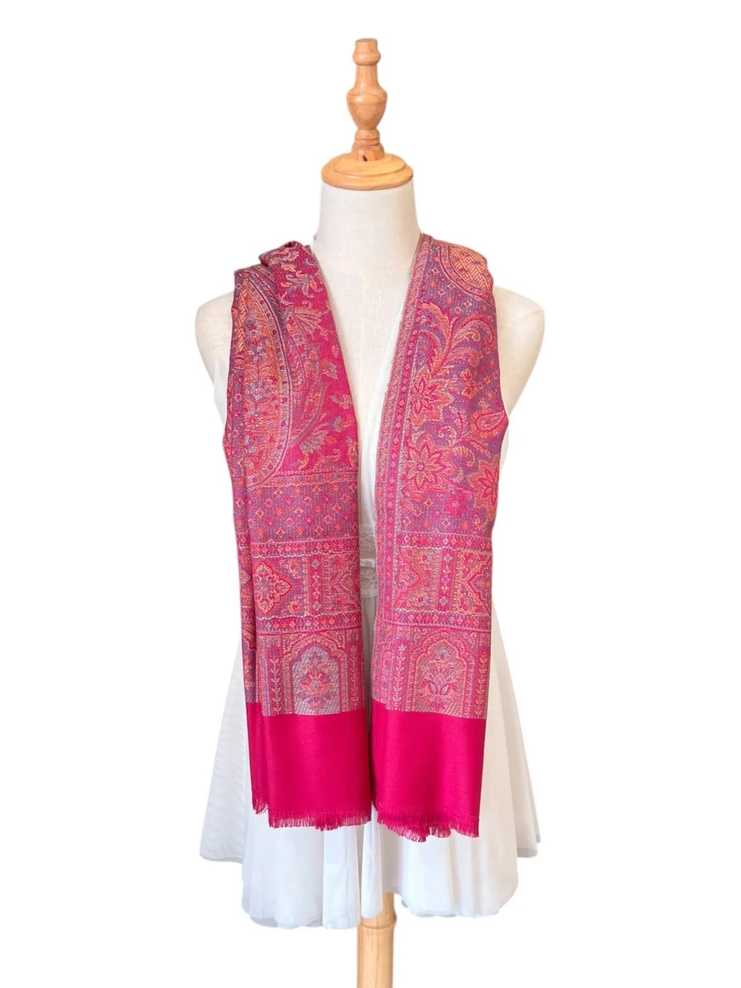 Noori Couture magenta pink cotton and wool shawl with intricate traditional woven patterns and delicate fringe edges.