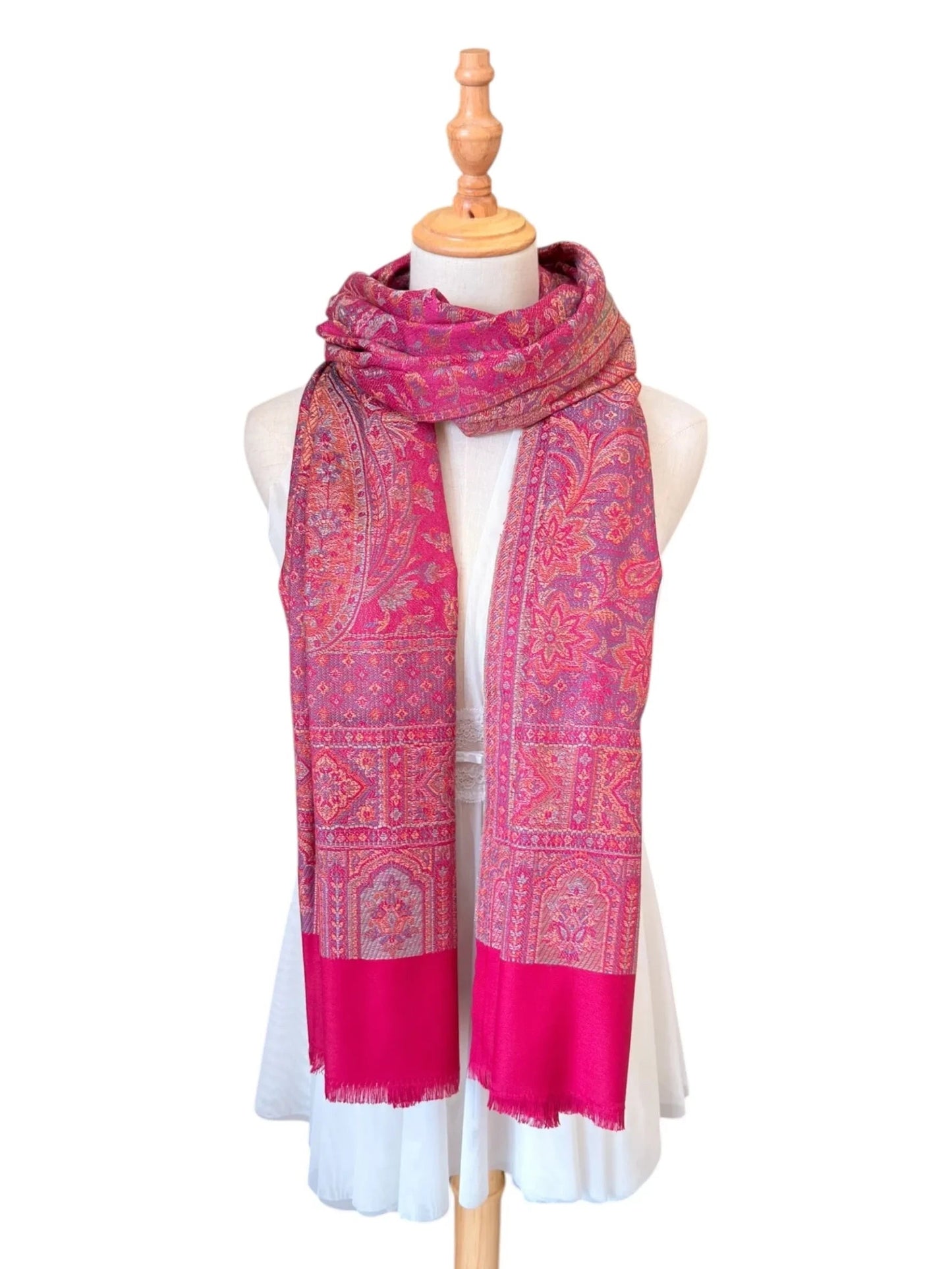 Noori Couture magenta pink cotton and wool shawl with intricate traditional woven patterns and delicate fringe edges.