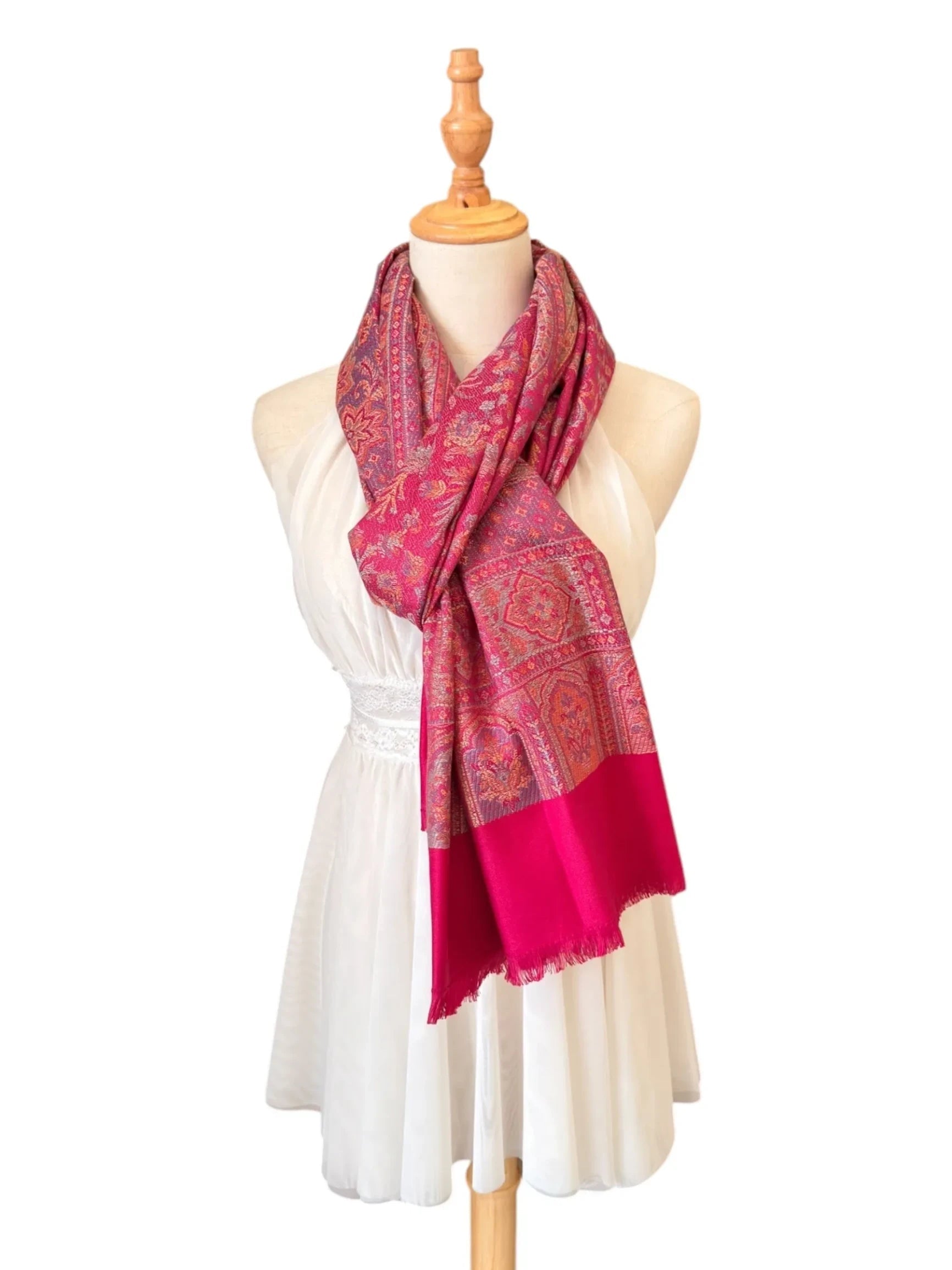 Noori Couture magenta pink cotton and wool shawl wrap with intricate traditional patterns and delicate fringe edges.