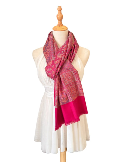 Noori Couture magenta pink cotton and wool shawl wrap with intricate traditional patterns and delicate fringe edges.