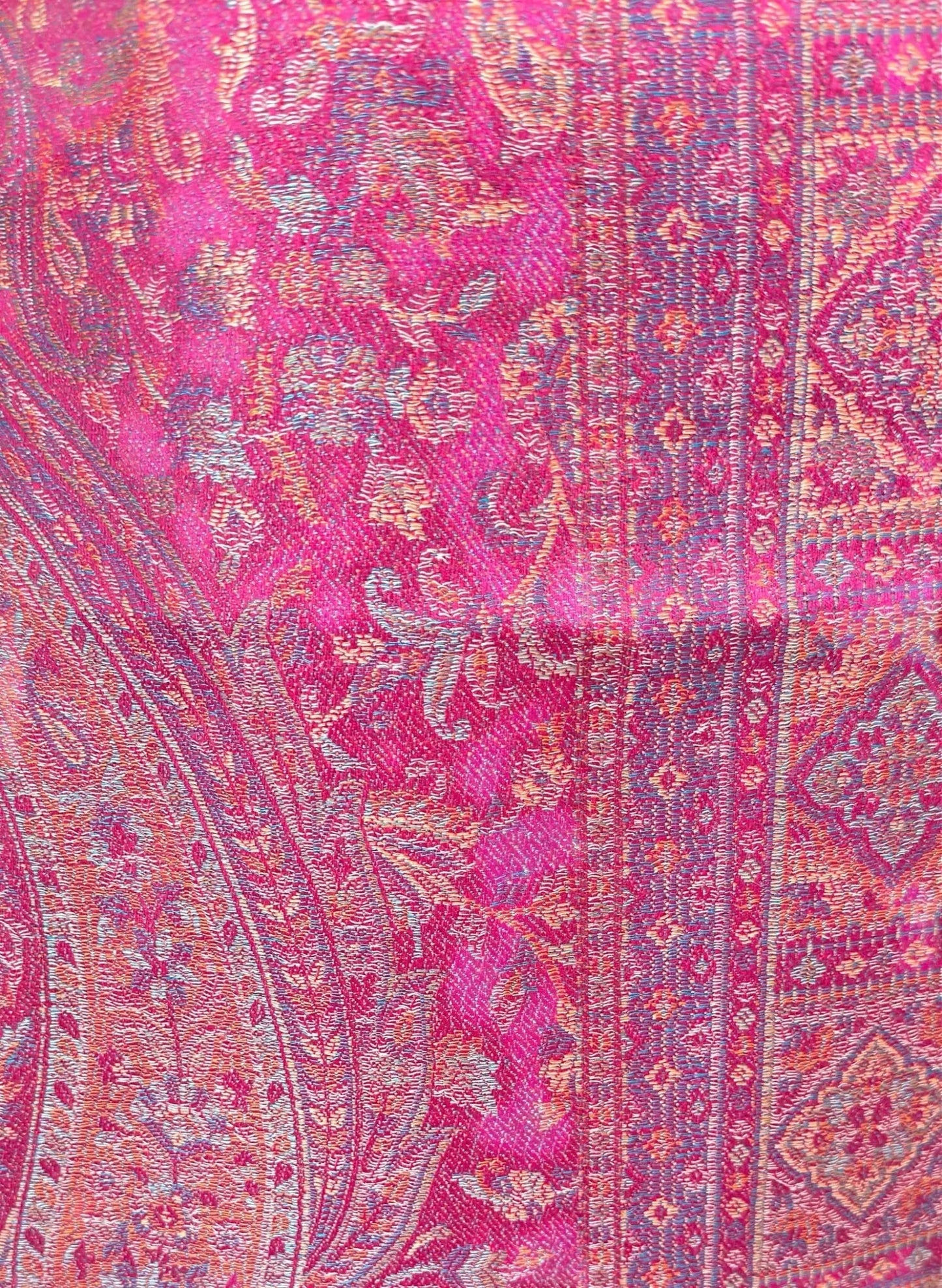 Noori Couture magenta pink shawl wrap featuring intricate traditional woven patterns and soft cotton-wool blend texture.