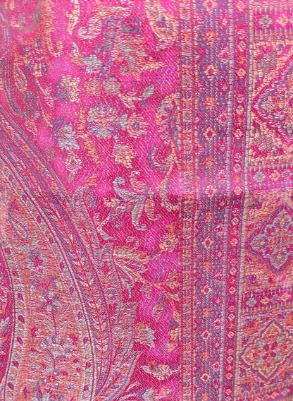 Noori Couture magenta pink shawl wrap featuring intricate traditional woven patterns and soft cotton-wool blend texture.