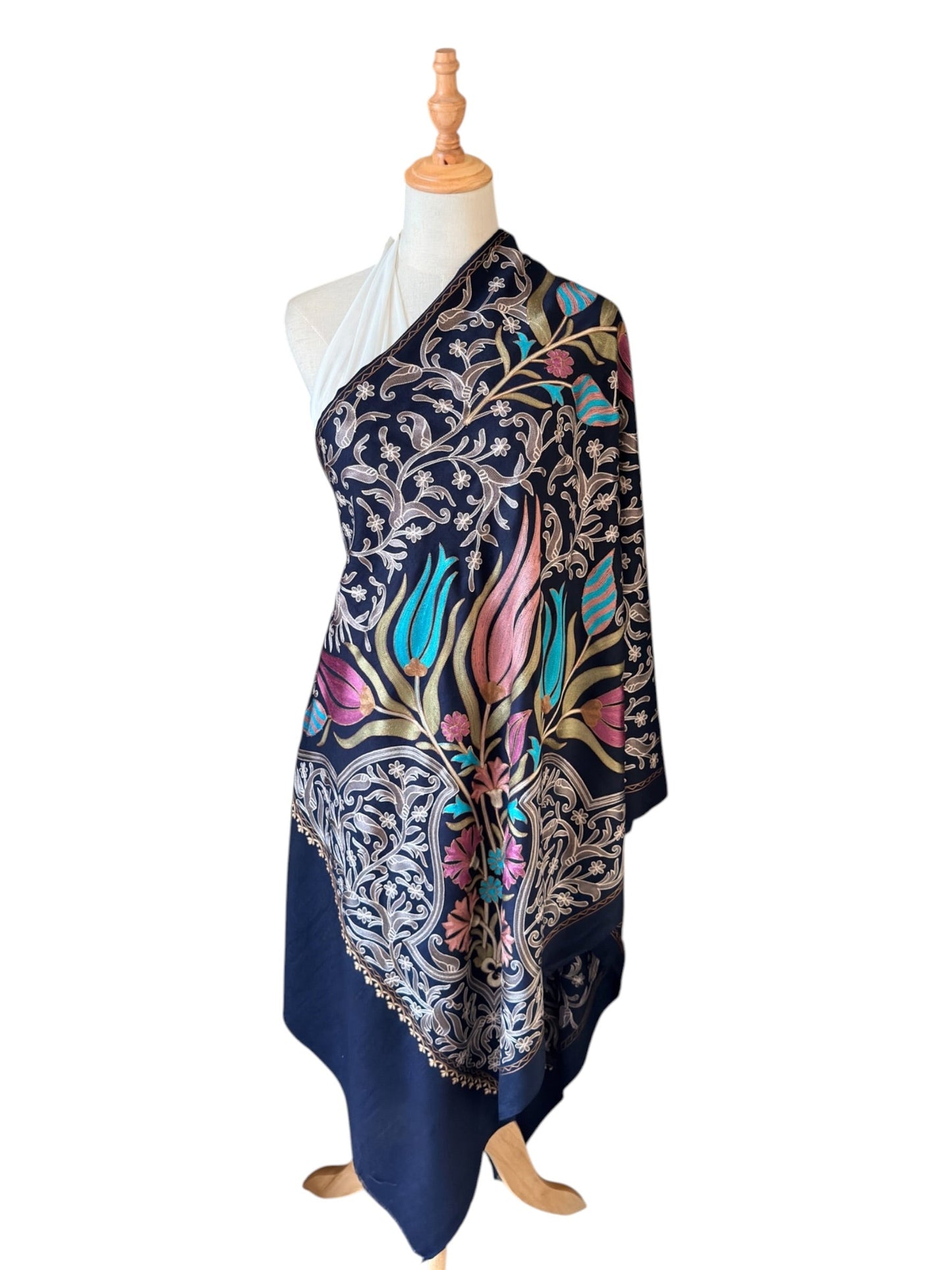 Noori Couture handwoven Montana Blue wool shawl featuring intricate multi-colored silk floral and vine embroidery.