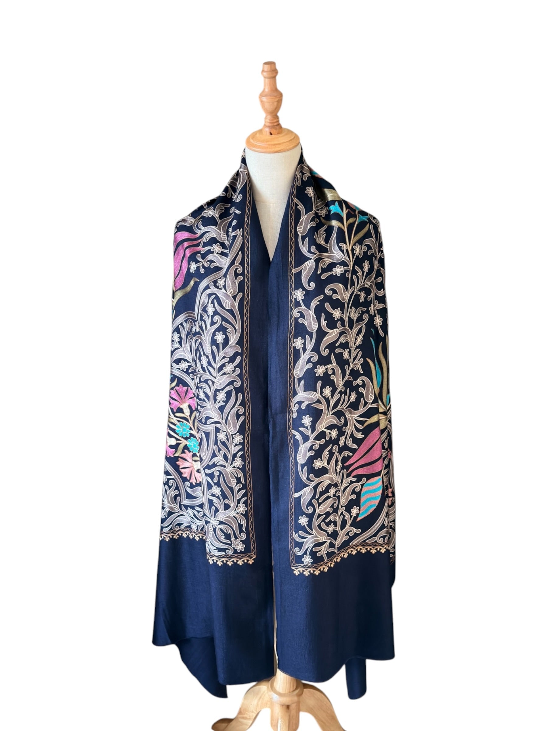Noori Couture handwoven Montana Blue wool shawl featuring intricate multi-colored silk floral and vine embroidery.