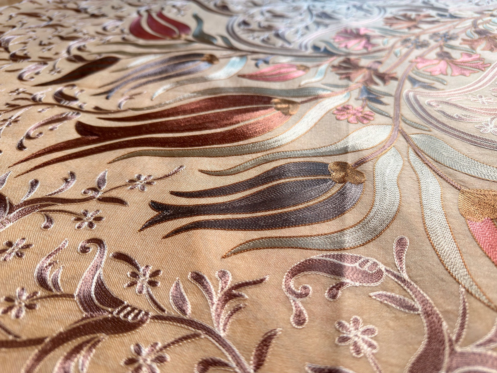 Noori Couture handwoven cream Nalki Jamawar shawl featuring intricate silk floral embroidery and fine wool texture.