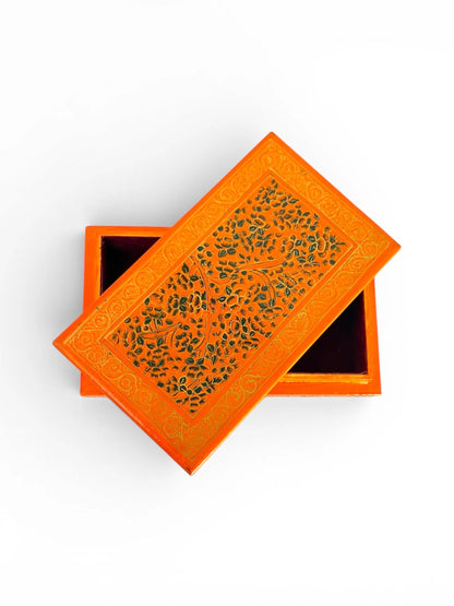 Noori Couture orange papier-mâché keepsake box with hand-painted green floral motifs and gold border.