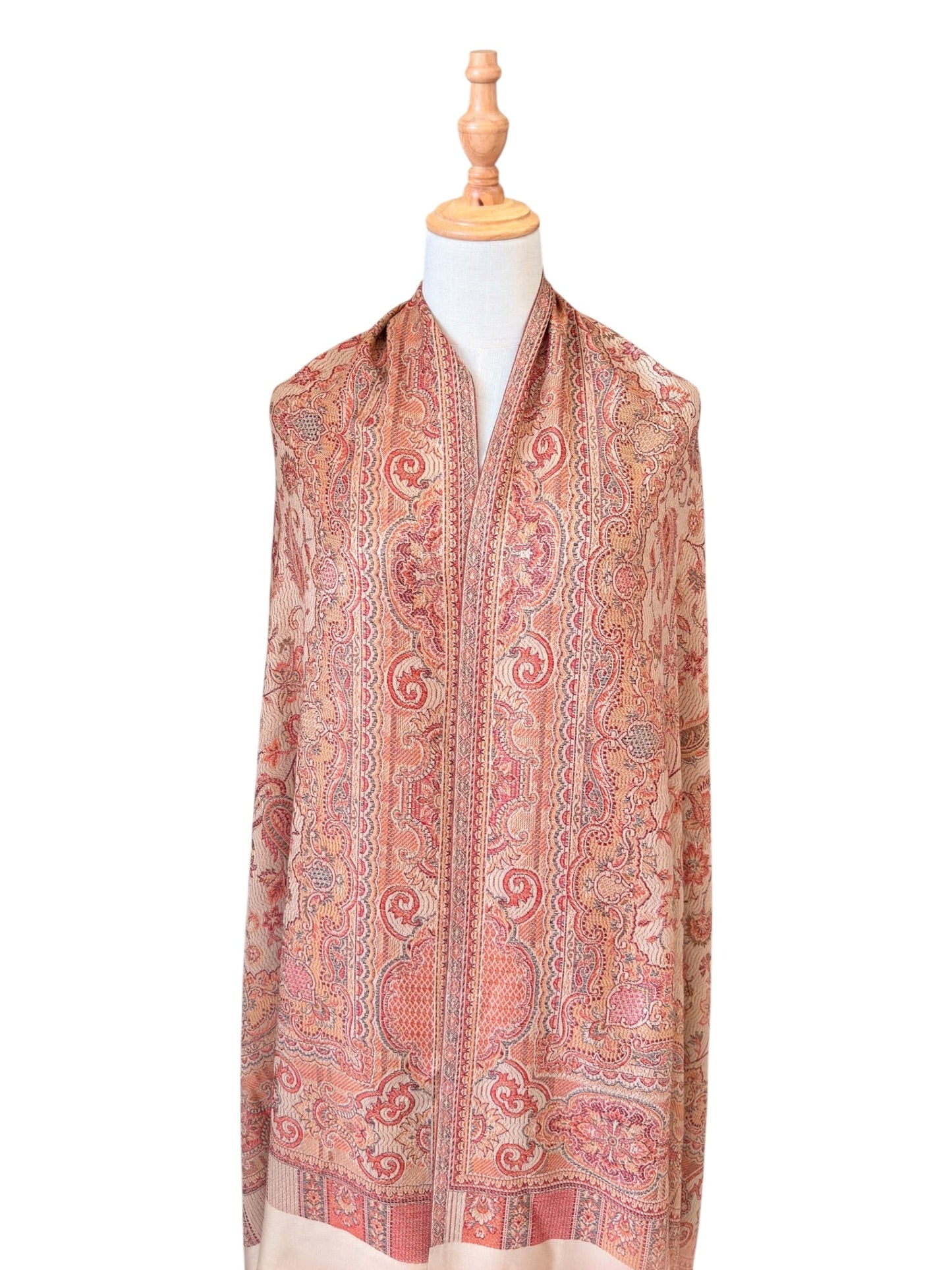 Noori Couture desert brown pashmina shawl featuring an intricate paisley pattern and delicate fringe on a mannequin