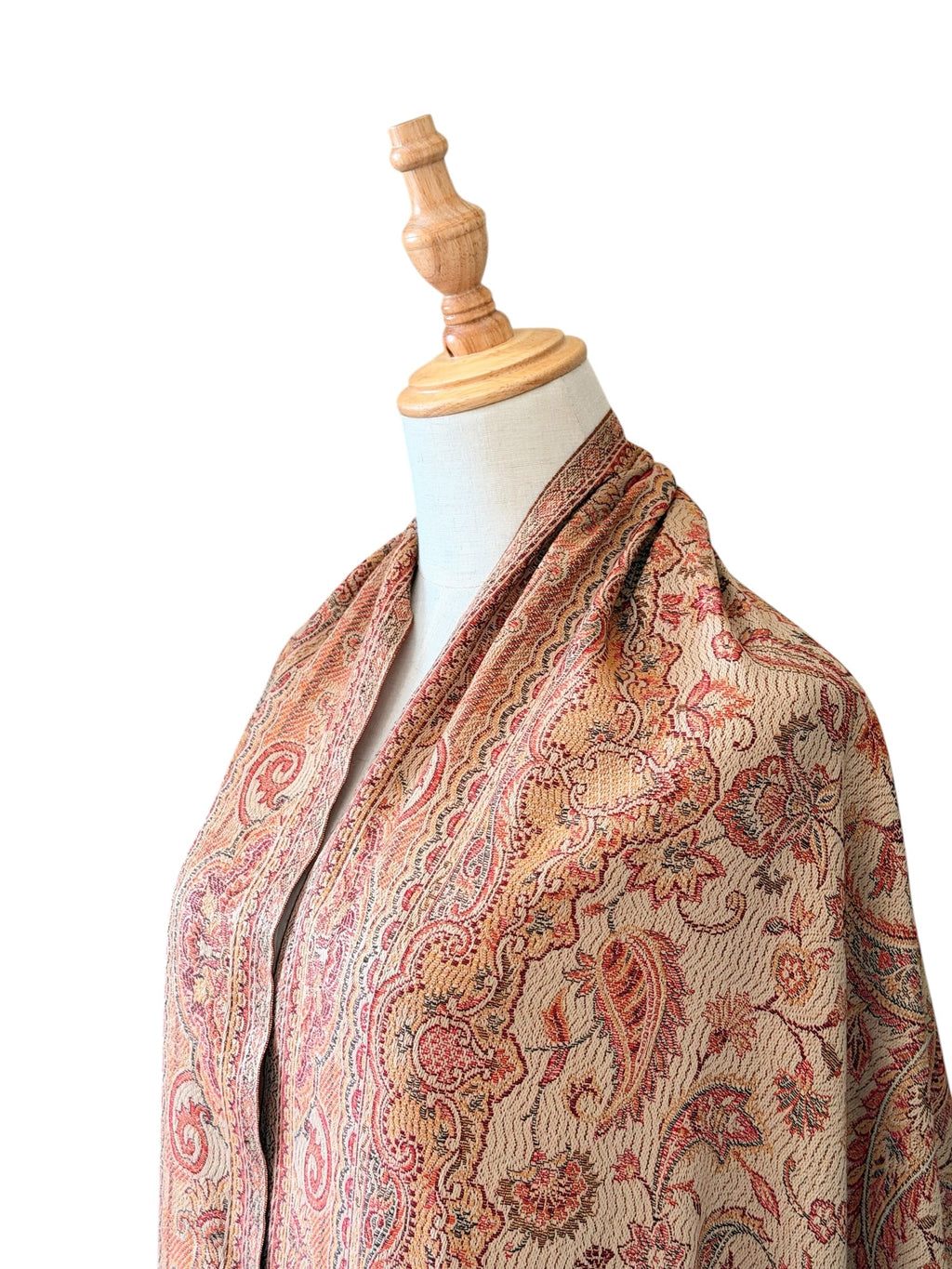 Noori Couture desert brown pashmina shawl featuring an intricate paisley pattern and delicate fringe on a mannequin