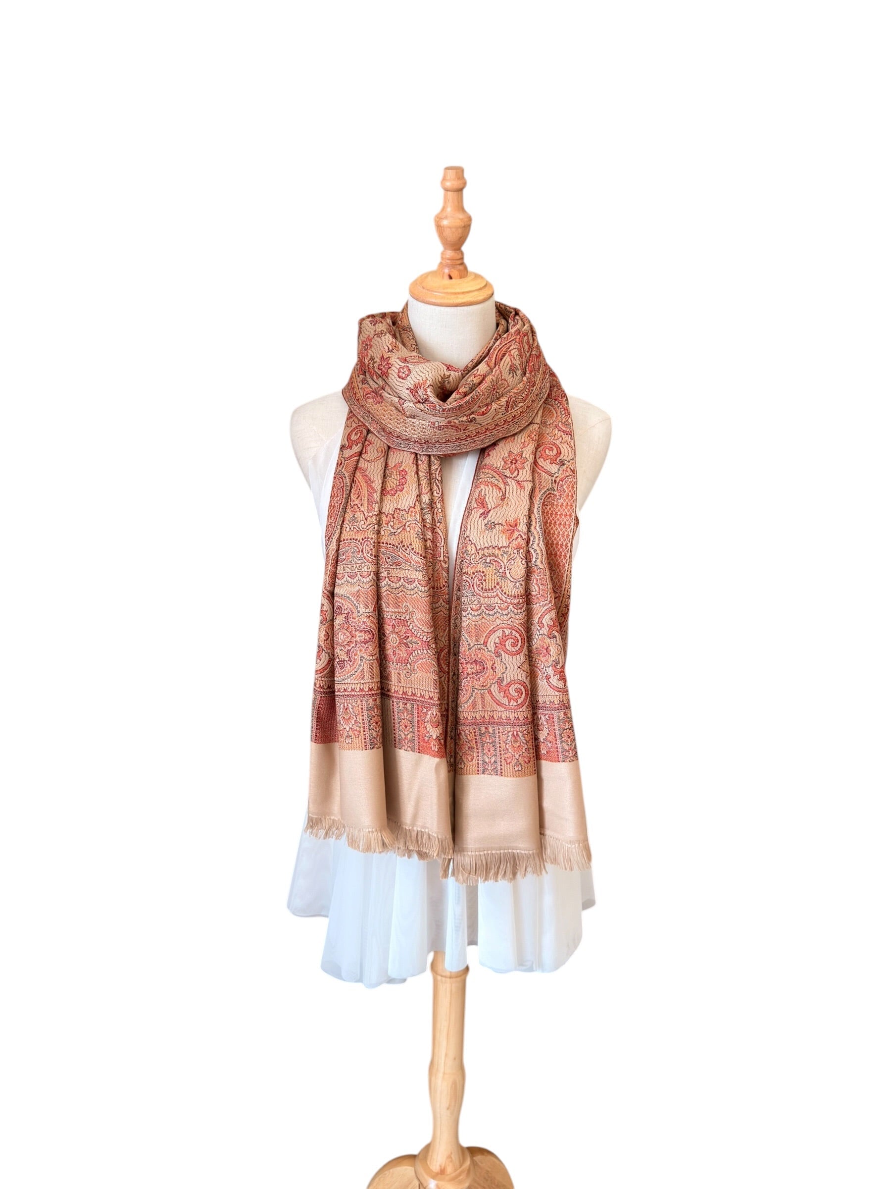 Noori Couture desert brown pashmina shawl with intricate paisley pattern and delicate fringe on a mannequin