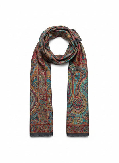 Noori Couture paisley patterned woven scarf in peacock shades with fringed edges.