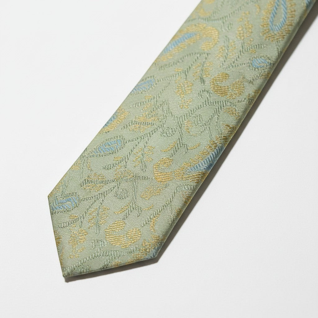 Noori Couture pale mint green silk and cotton blend tie with gold and sky blue paisley pattern.