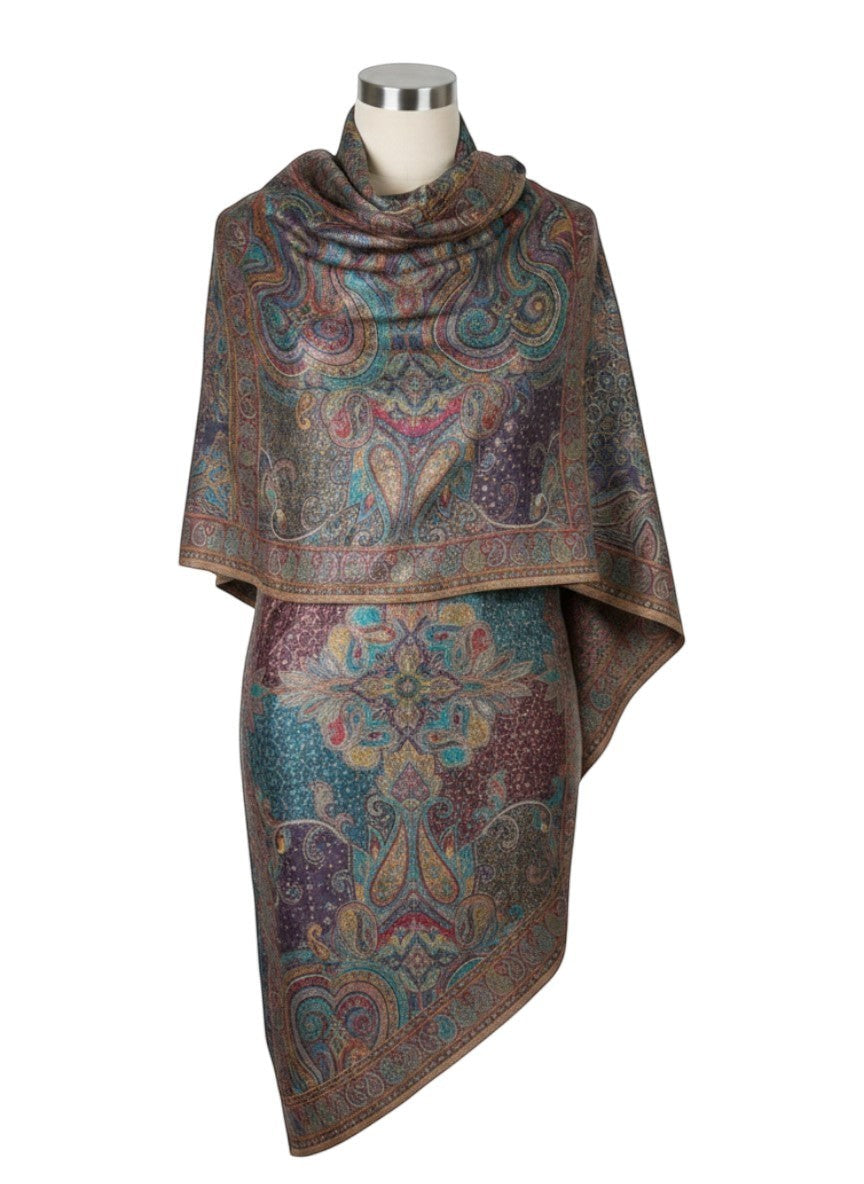 Noori Couture paisley patterned woven scarf in peacock shades with fringed edges.