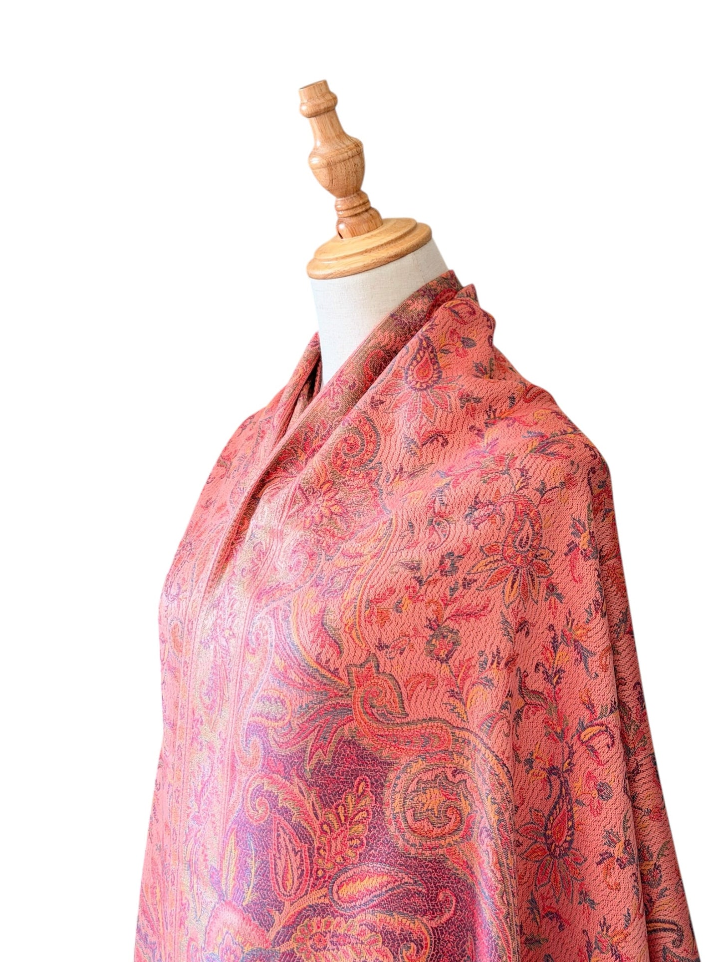 Noori Couture pastel pink pashmina shawl with intricate paisley pattern and delicate fringe on a mannequin