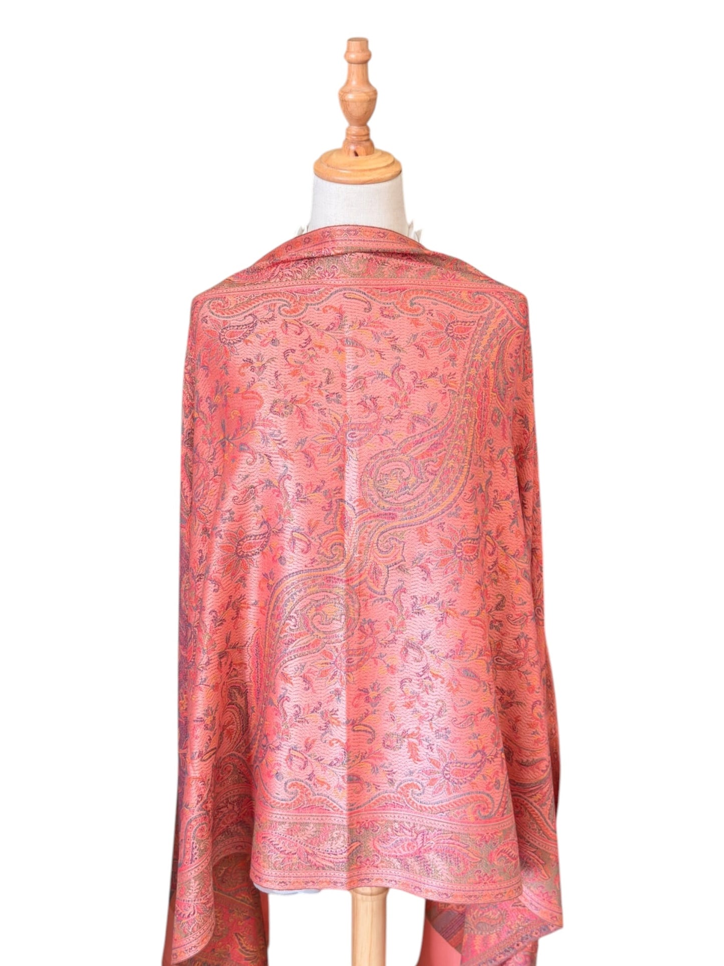 Noori Couture pastel pink pashmina shawl with intricate paisley pattern and fringe on a mannequin