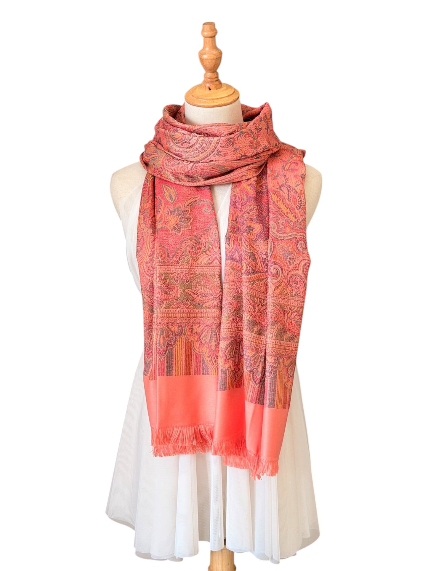 Noori Couture pastel pink pashmina shawl with intricate paisley patterns and delicate fringe on a mannequin