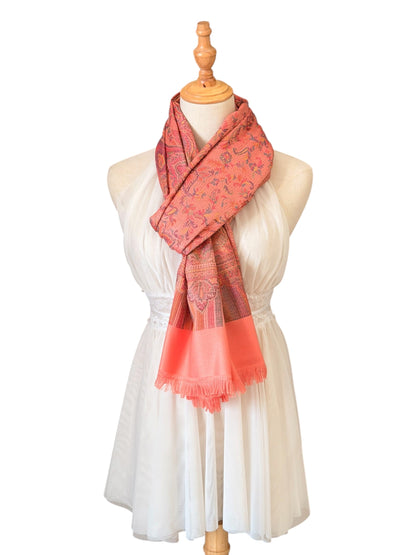 Noori Couture pastel pink pashmina shawl with intricate paisley patterns and delicate fringe on a mannequin