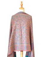 Noori Couture pashmina shawl featuring intricate teal, violet, and gold paisley and geometric patterns with fringed hem.