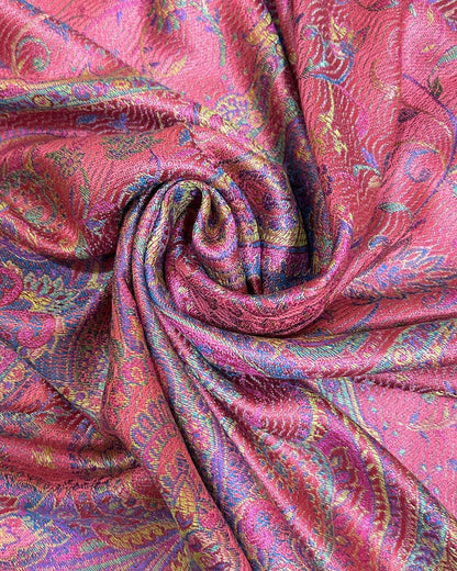 Noori Couture pink mulberry silk shawl with intricate paisley pattern in purple, gold, and blue. Features delicate fringe detailing.
