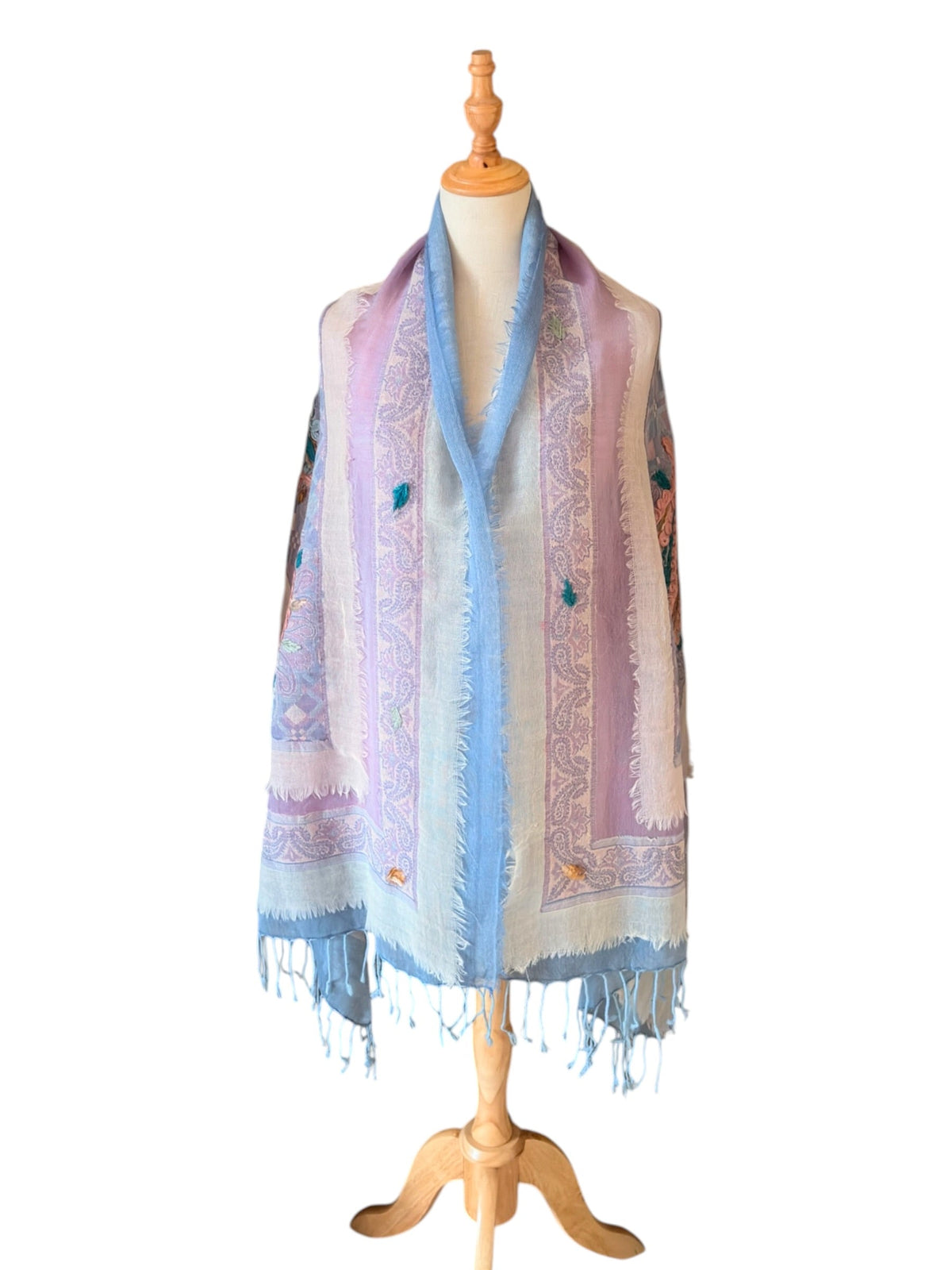Noori Couture purple and blue merino boil wool shawl with intricate hand-embroidered details and frayed fringe edges.
