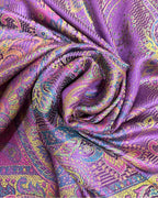 Noori Couture handwoven pure silk shawl in vibrant purple with intricate paisley patterns in yellow, pink, and blue.