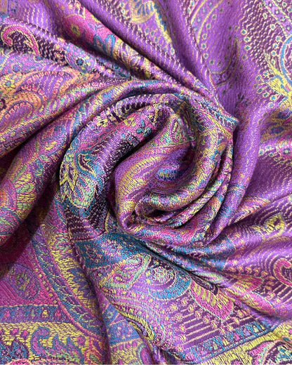 Noori Couture handwoven pure silk shawl in vibrant purple with intricate paisley patterns in yellow, pink, and blue.