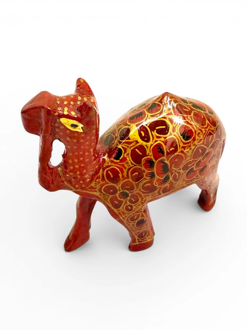Noori Couture red papier-mâché camel figurine with intricate gold and black floral detailing, a decorative collectible.