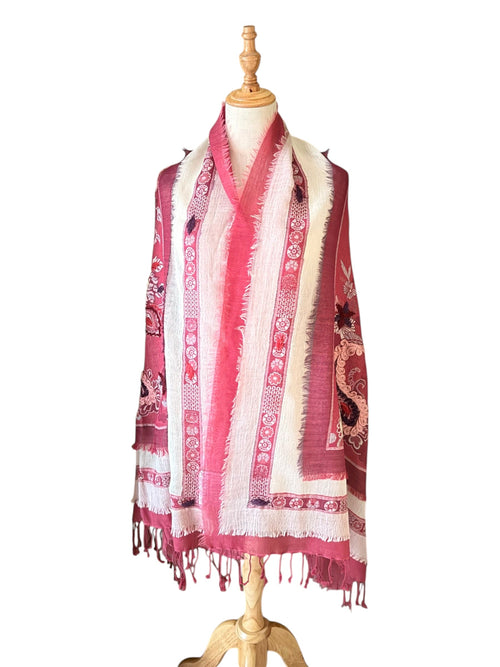 Noori Couture red merino boil wool shawl with intricate hand-embroidered floral patterns and frayed edge detailing.