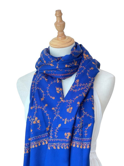 Noori Couture royal blue handwoven shawl with intricate orange floral embroidery and jali detailing.