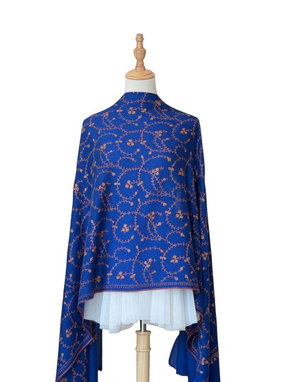 Noori Couture royal blue handwoven shawl with intricate orange floral embroidery and jali detailing.