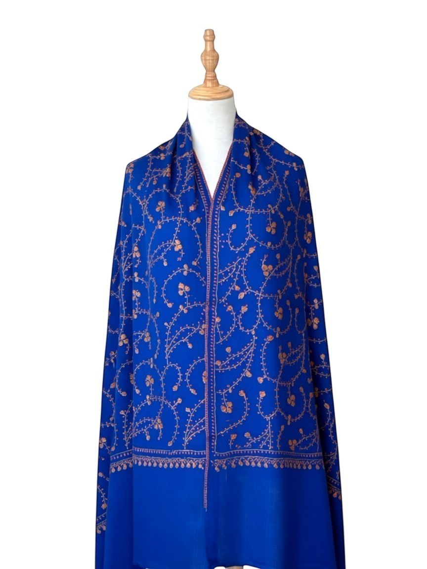 Noori Couture royal blue handwoven shawl with intricate Sozni Jali embroidery and a decorative border.