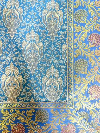 Noori Couture Royal Cushion Cover in blue jacquard fabric with damask pattern and gold cord trim.