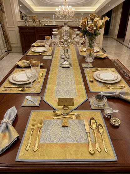 Noori Couture Limited Edition Royal Dining Set: 13-piece luxury table runner, placemats & coasters with gold and silver damask pattern.