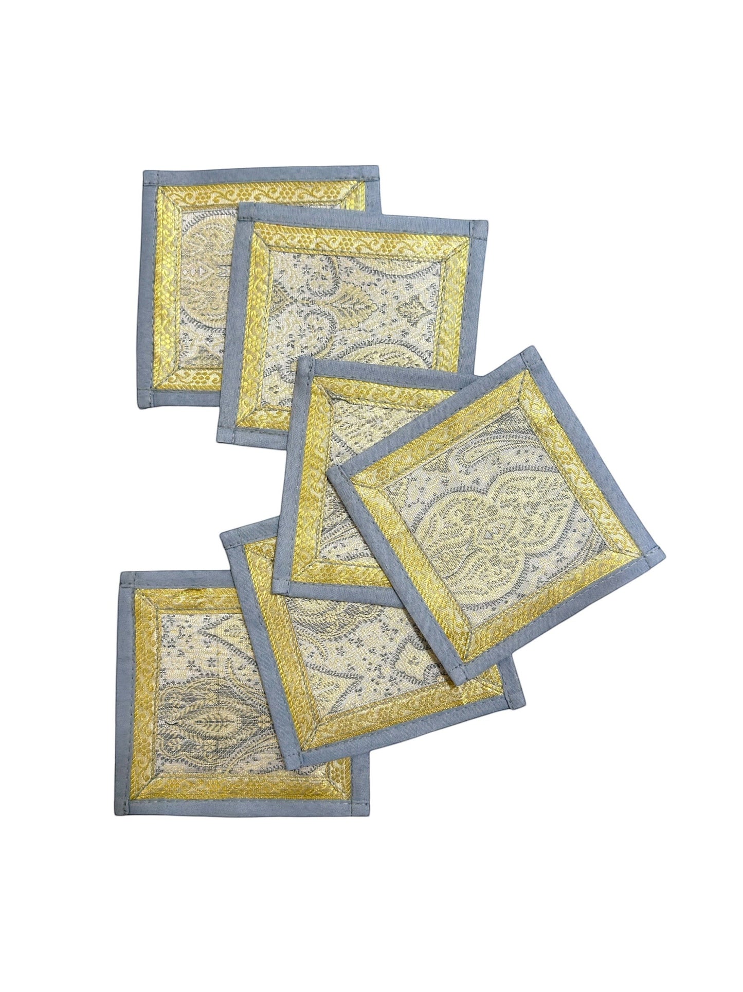 Noori Couture Limited Edition Royal Dining Set coasters with gold and silver damask pattern and grey border.