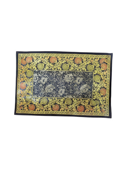 Noori Couture Royal Dining Set placemat with ornate gold floral pattern on navy blue fabric.